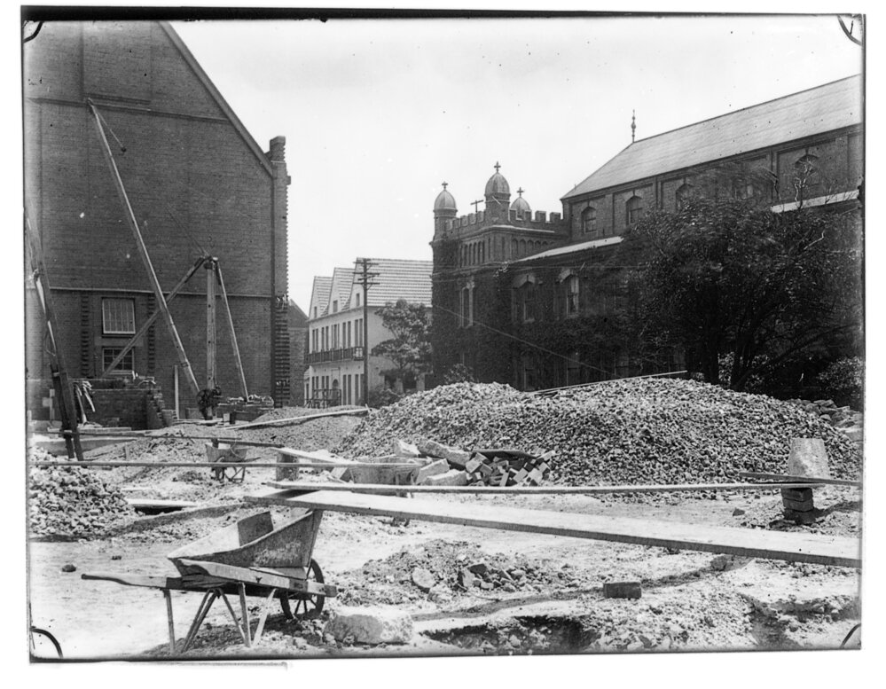 Construction of North and West Ranges of the Quadrangle, Macleay Museum in Background