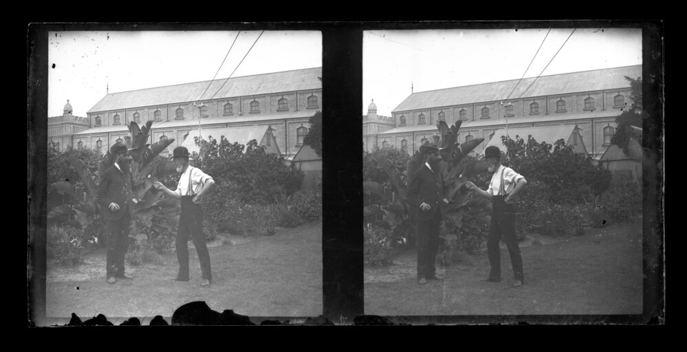 Two Men on University Grounds with Macleay Museum in the Background