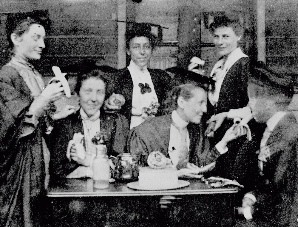 Female Students Outside Women's Common Room Eating Bananas