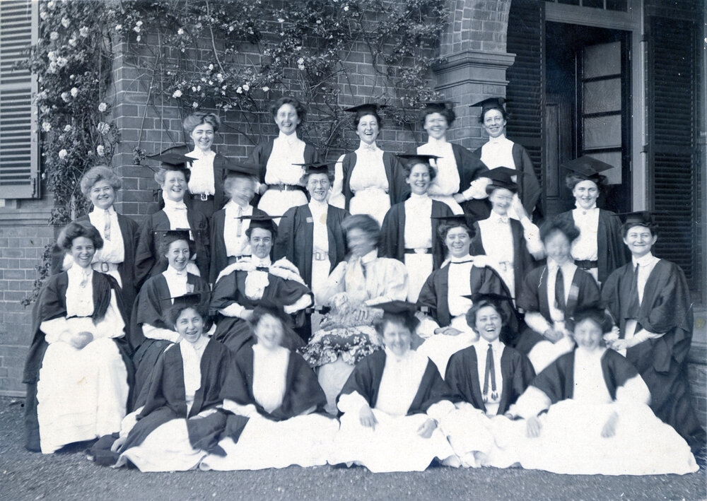 Group Of Women's College Students And Principal