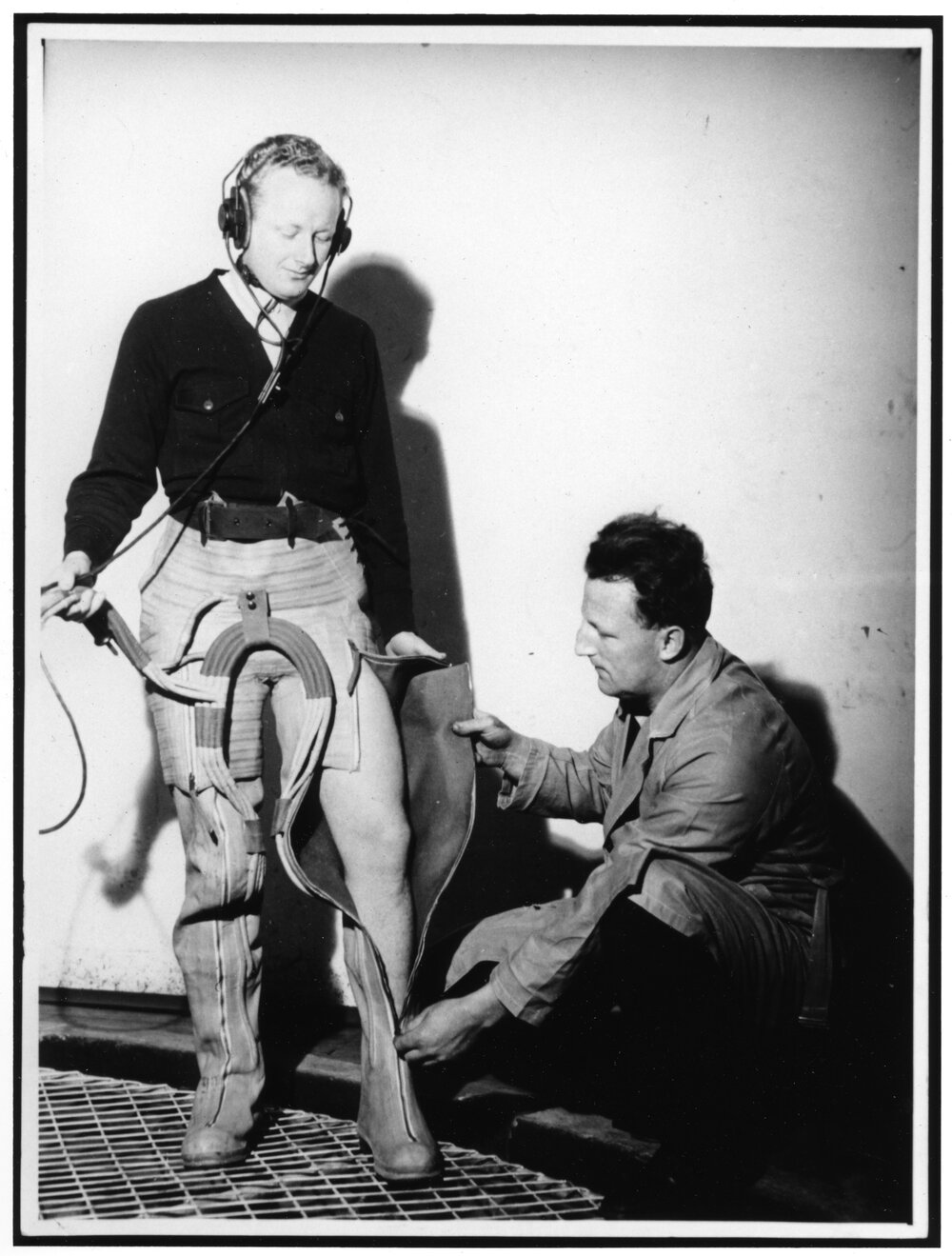 Professor Frank Cotton's Assistant Dressing in the G Suit