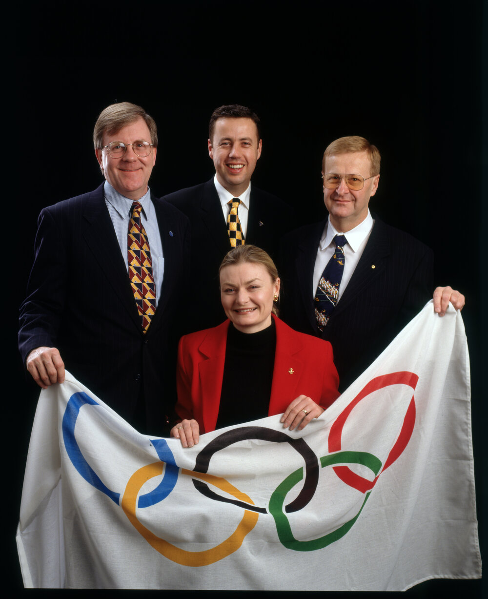 Sandy Hollway, Craig Hassall, Jane Spring and John Coates with Olympic Flag