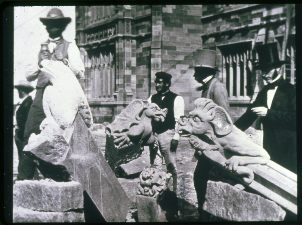 Stone Mason Carving Gargoyles - Close Up