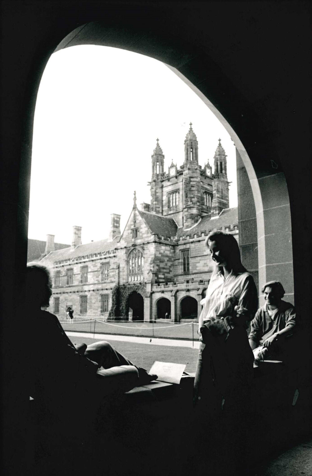 Students Seated in Quadrangle Arch
