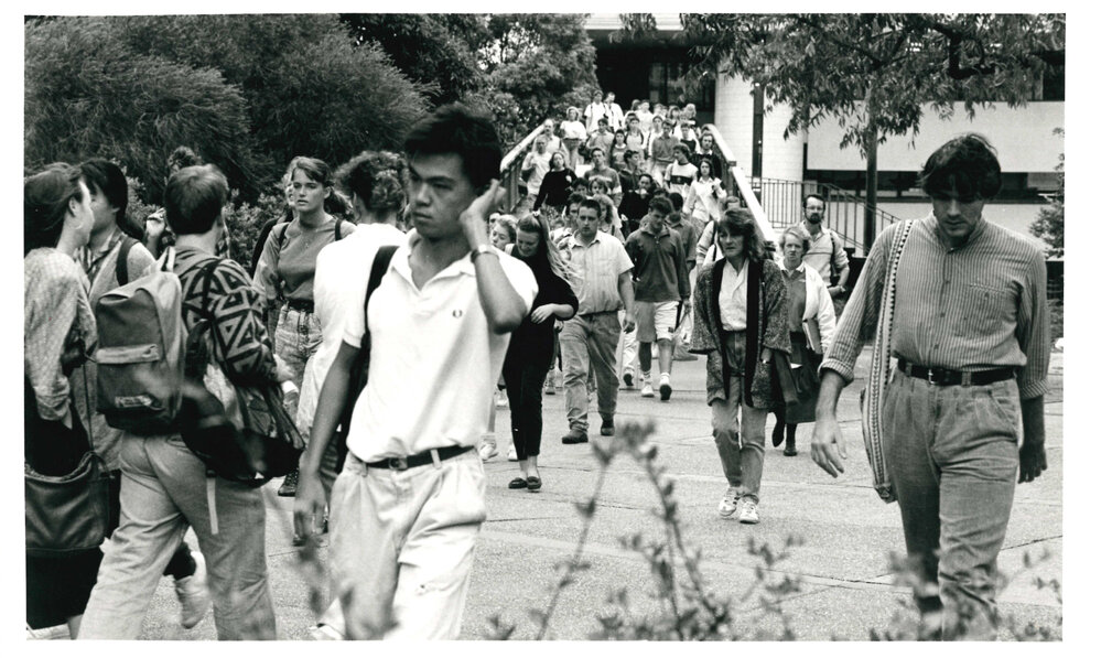Students Walking Across City Road Footbridge
