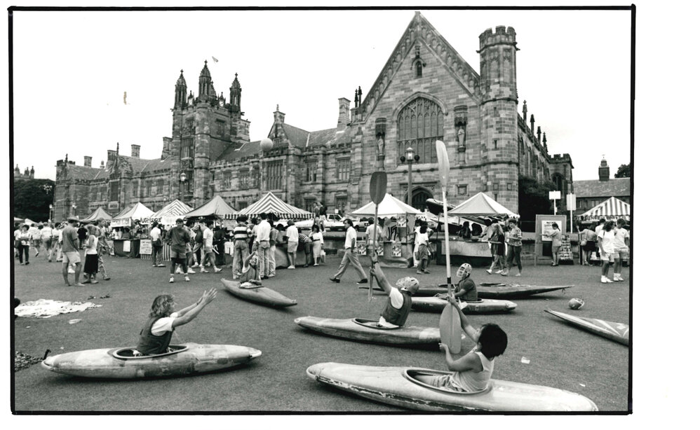 Students in Kayaks on Quadrangle Front Lawns, Orientation Week 