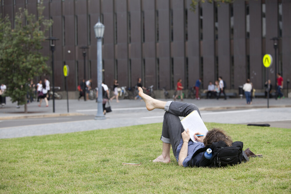 Student Relaxing on the Front Lawn