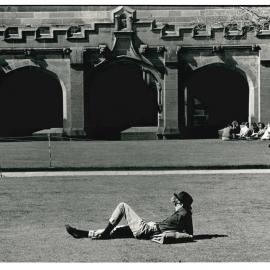 Student Relaxing on the Quadrangle Lawn