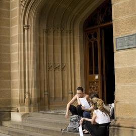 Students Sitting in the Entranceway to Anderson Stuart Building