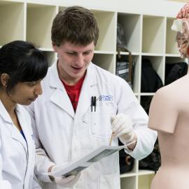 Medicine Students with Anatomy Model