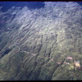 Aerial View of Mountain and Village