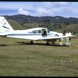Three Men with Plane, Papua New Guinea