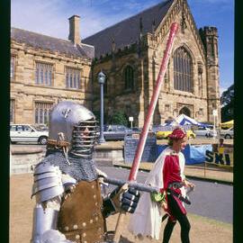 Two Students in Medieval Armour on Front Lawn During Orientation Week 1987