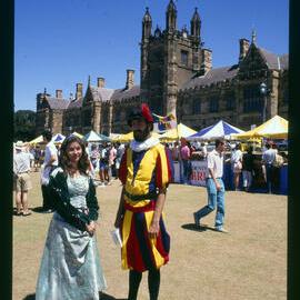 Two Students in Medieval Clothing on Front Lawn During Orientation Week 1987