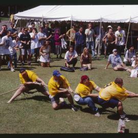 Students in Tug of War on Front Lawn During Orientation