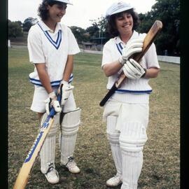 Two Women Cricketers with Bats