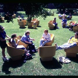 Students in Outdoor Arm Chairs on Cumberland Campus Lawn