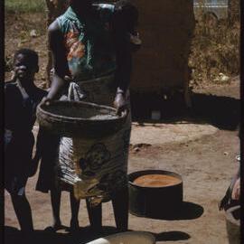 Woman with Cooking Equipment