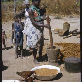 Woman Using Mortar and Pestle