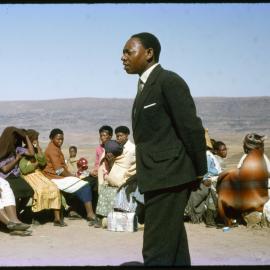 Man Talking to Seated Group