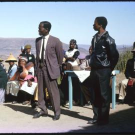 Group of People with Mountains in Distance