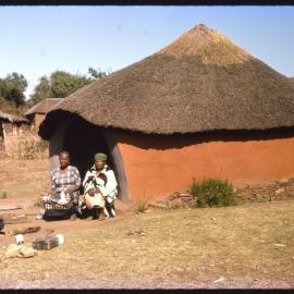 Women Sitting outside Rondavel