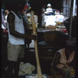 Man Using Mortar and Pestle