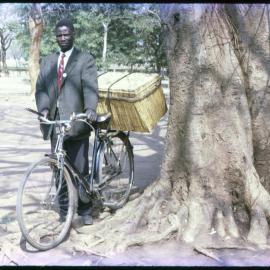 Man Standing with Bicycle