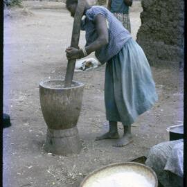 Woman Using Mortar and Pestle