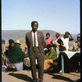 Group of People with Mountains in Distance