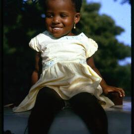 Girl Sitting on Car Roof