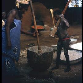 Woman and Boy Using Mortar and Pestle