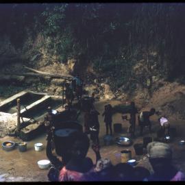 Group of People in Stream