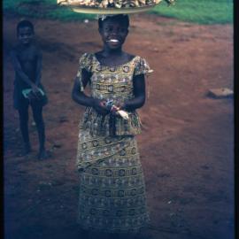 Girl Carrying Tray on her Head