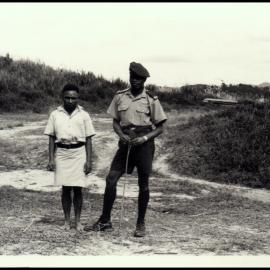 Eba, a Local Interpreter and Tororano, a Policeman