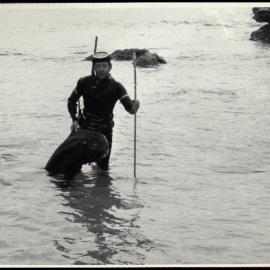 John Thompson Holding a Speared Fish