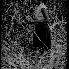 Girl Standing in Field