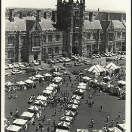 Stalls on Welcome Day with Cars Parked in Front of Main Building as Seen from Above Library Building