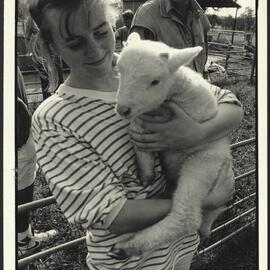 A Veterinary Student Holding a Lamb at the Research Centre in Camden