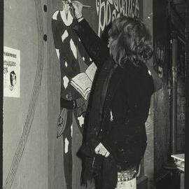 Student Painting Image in the Graffiti Tunnel Relating to the Renaissance Players