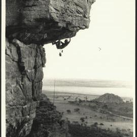 A Rock Climber Hanging off a Rock High on the Mountain - Climbing at Kachoong Mount Arapiles 