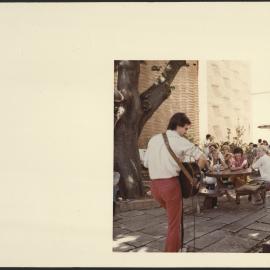  Guitarist Providing Outdoor Entertainment at the Holme Building