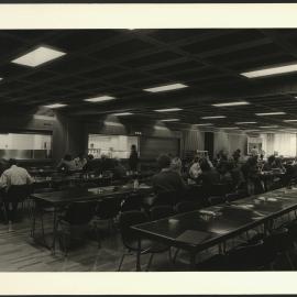 Staff and Students Enjoy a Meal in the New Cafeteria Wentworth Building with Service Counters in the Background