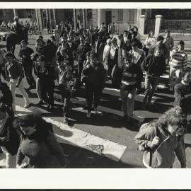 Student Foot Traffic to the University with a Policeman on Horseback in the Background(2)