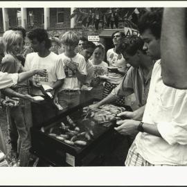 Students at the Barbeque Waiting for Sausages