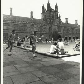 Two Runners in Quadrangle Courtyard During Student Fun Run 1989