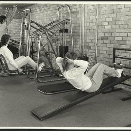 Women Trying Out Equipment in the New Sports Gymnasium
