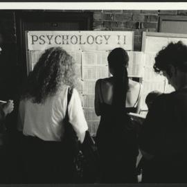 Student Checking Display Boards for Their Psychology 2 Examination Results