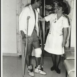 Faculty of Nursing - On the Ward Nursing Student with Patient on Crutches