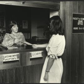 Staff Assisting with an Enquiry at the Faculty of Economics Office Counter